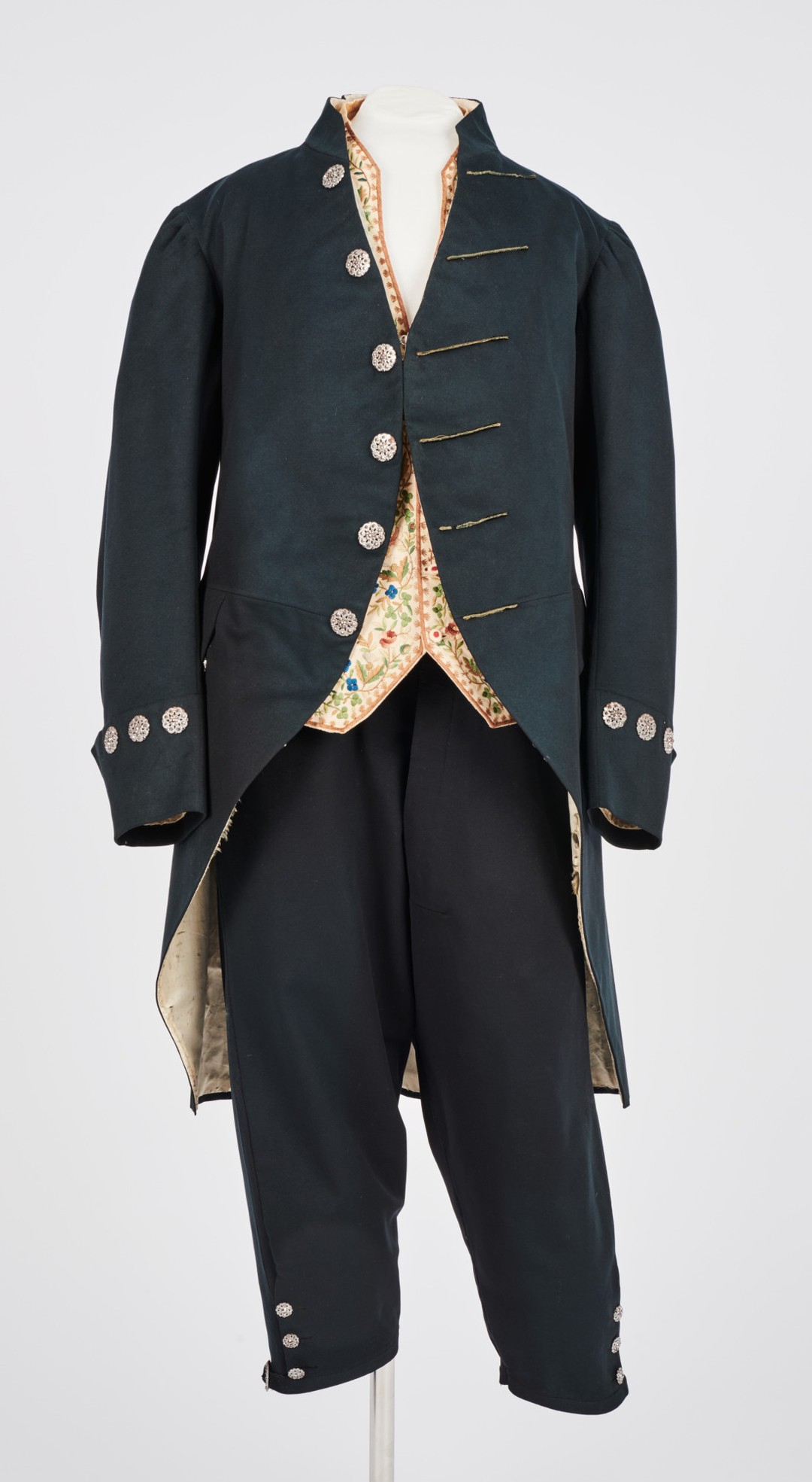 A mannequin dressed in an old fashioned suit