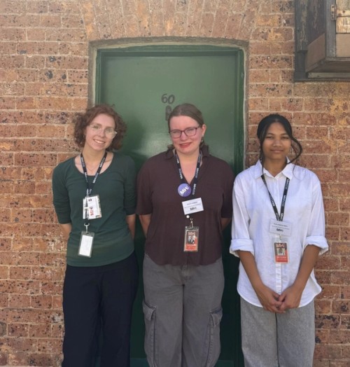 Three Year 10 students have their photo taken during work experience