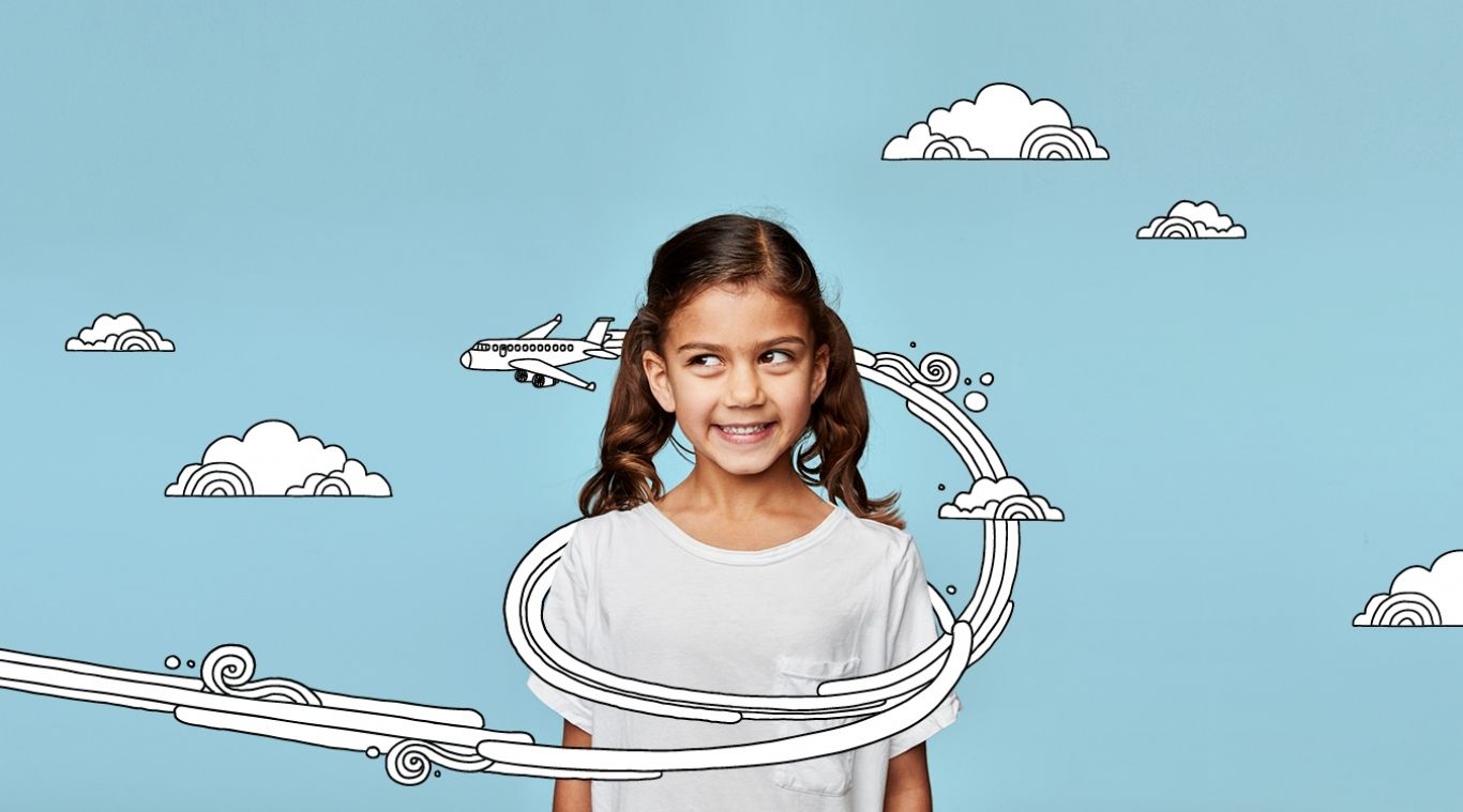 Girl with superimposed illustration of aeroplane and clouds