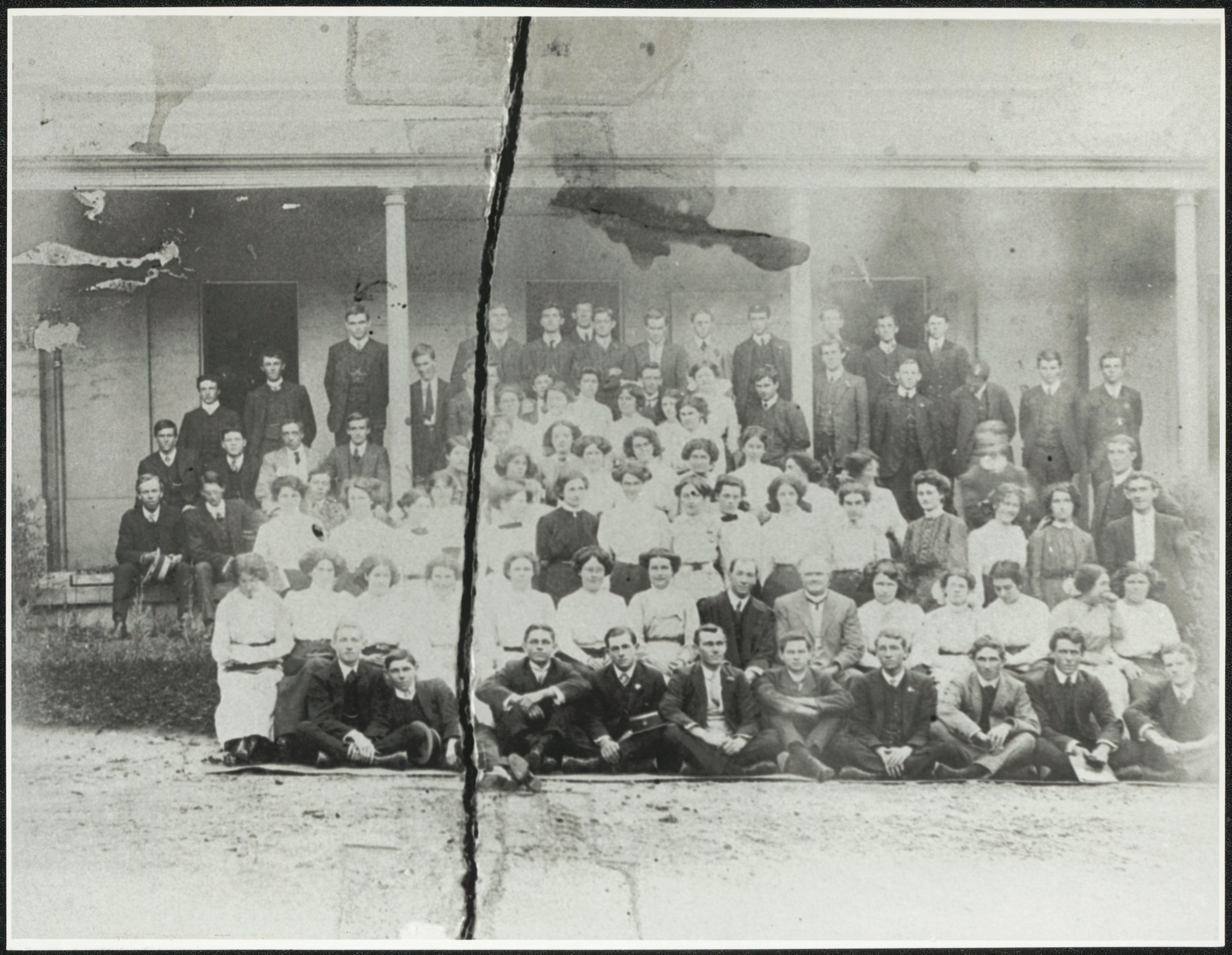 A group of teachers in training pose for a photo
