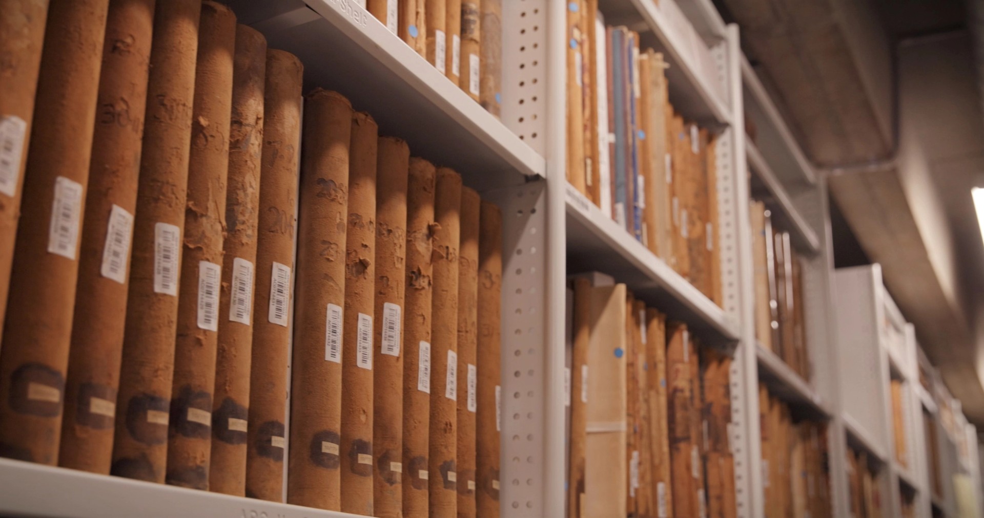 Old books stored upright on shelving
