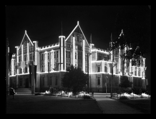 Night view, a building is lit by lighting strung up on the outside
