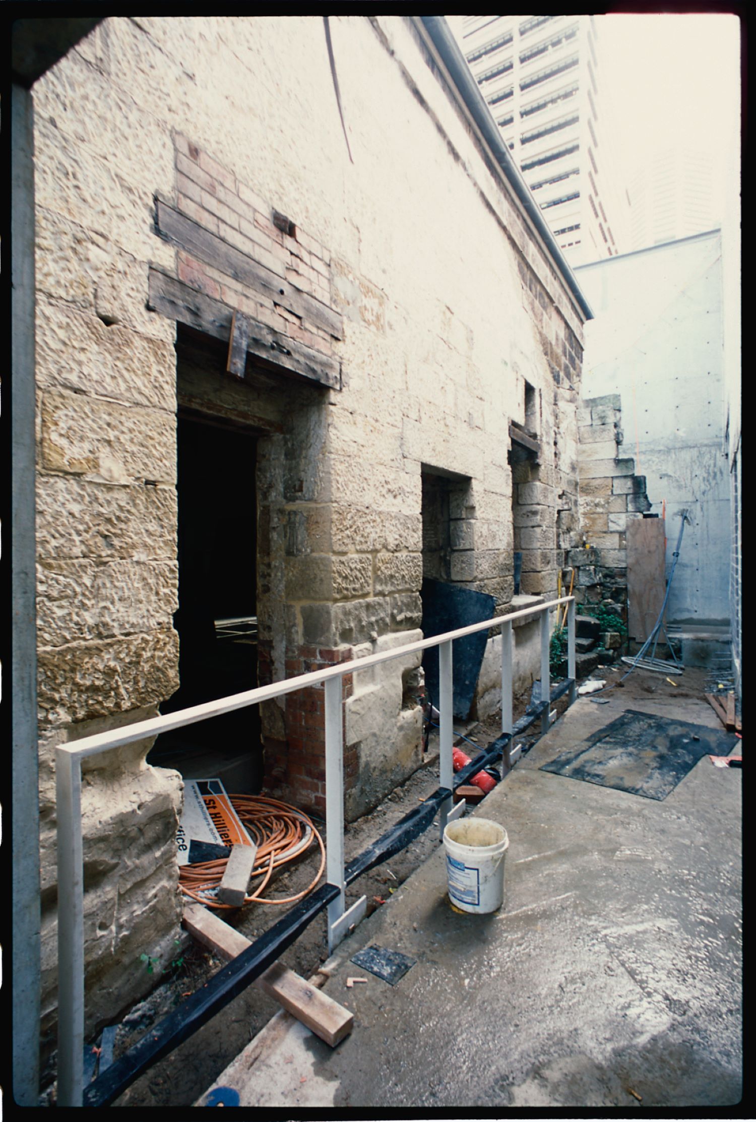 Original door and window openings had been closed up, the sandstone wall fragmented from 20th century demolitions and, while evidence of minting processes and use remained, urgent conservation work was required