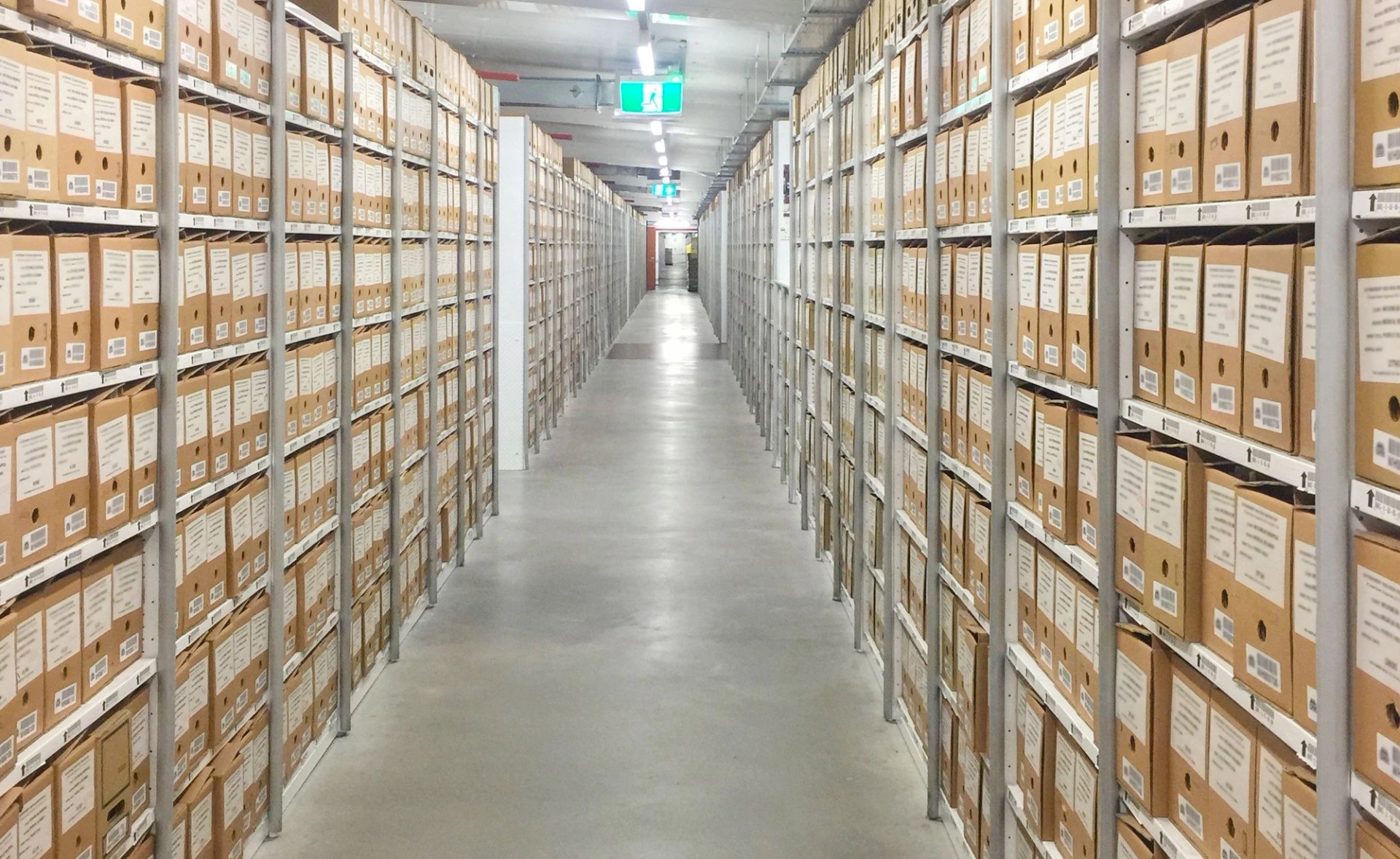 Records storage boxes on rows of shelves