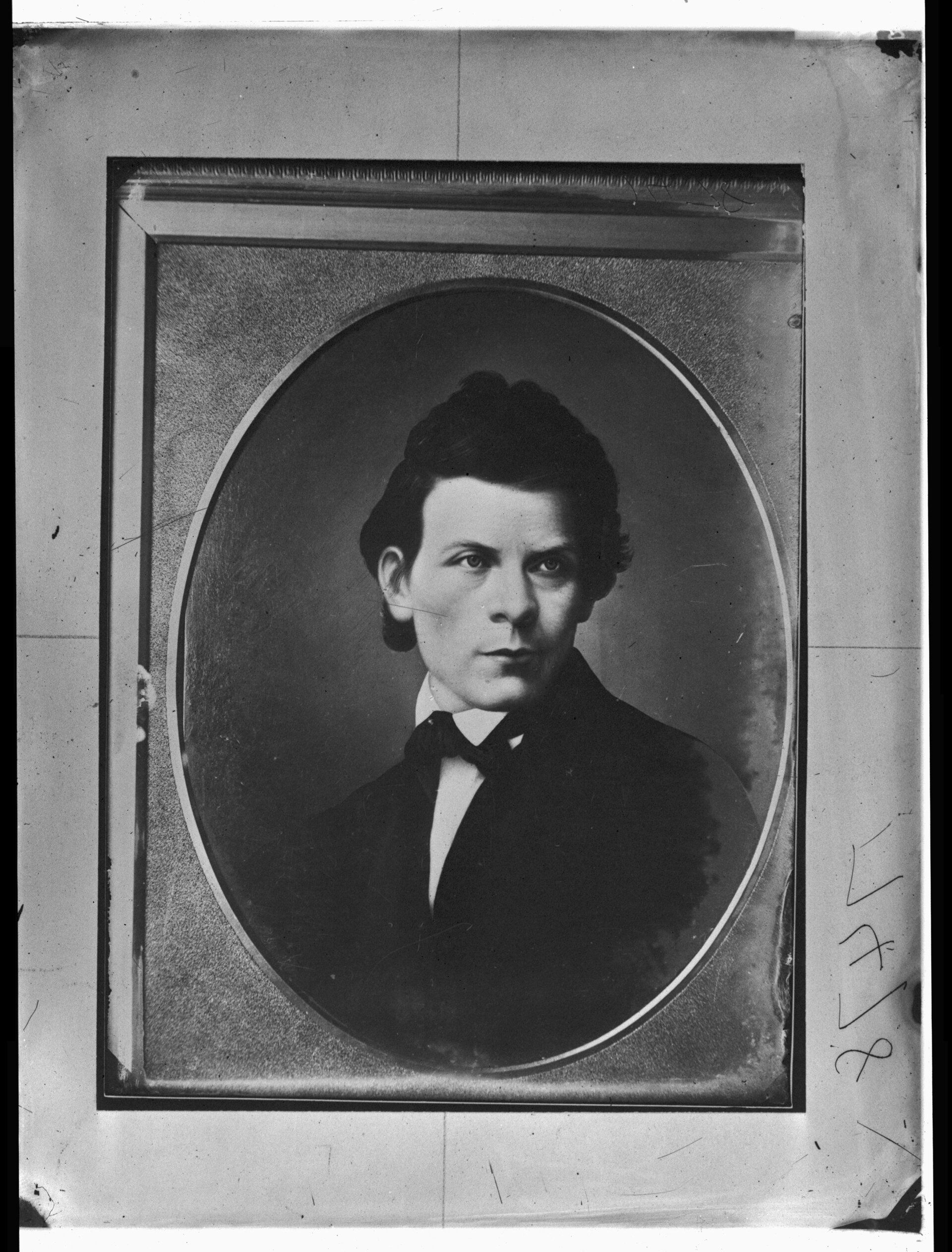 Black and white photo of a portrait of a young man