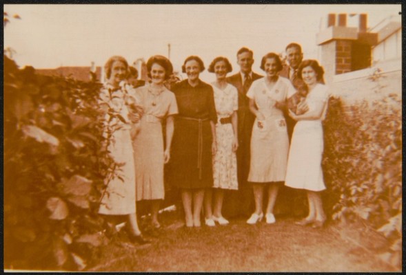A group of men and women pose for the camera