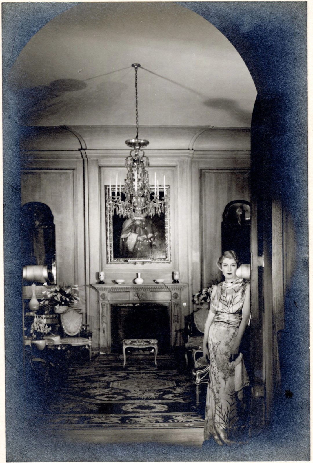 Portrait of a woman standing in a well decorated room