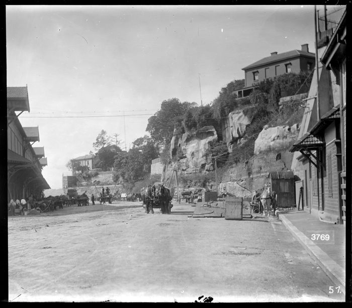 Black and white photo showing wharf, horses and drays, Cowper Wharf Road