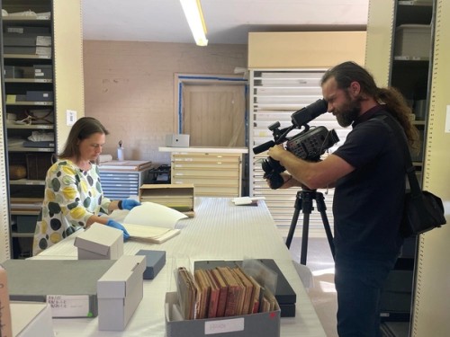 Two staff members filming the second set of videos for the Storyplace Roadshow 