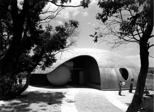 Students stand to the side of a dome like structure