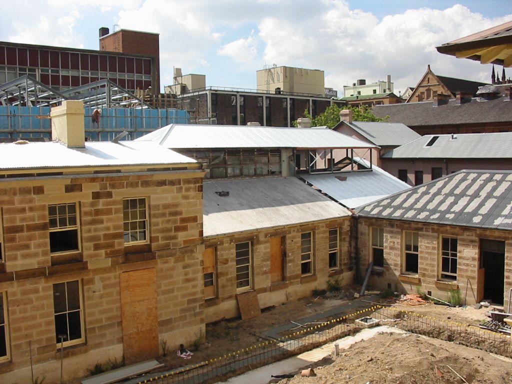 The coining room and workshop wing (right) at commencement of the project, February 2002. Stone conservation works to the buildings and exterior cladding removed from the clerestory