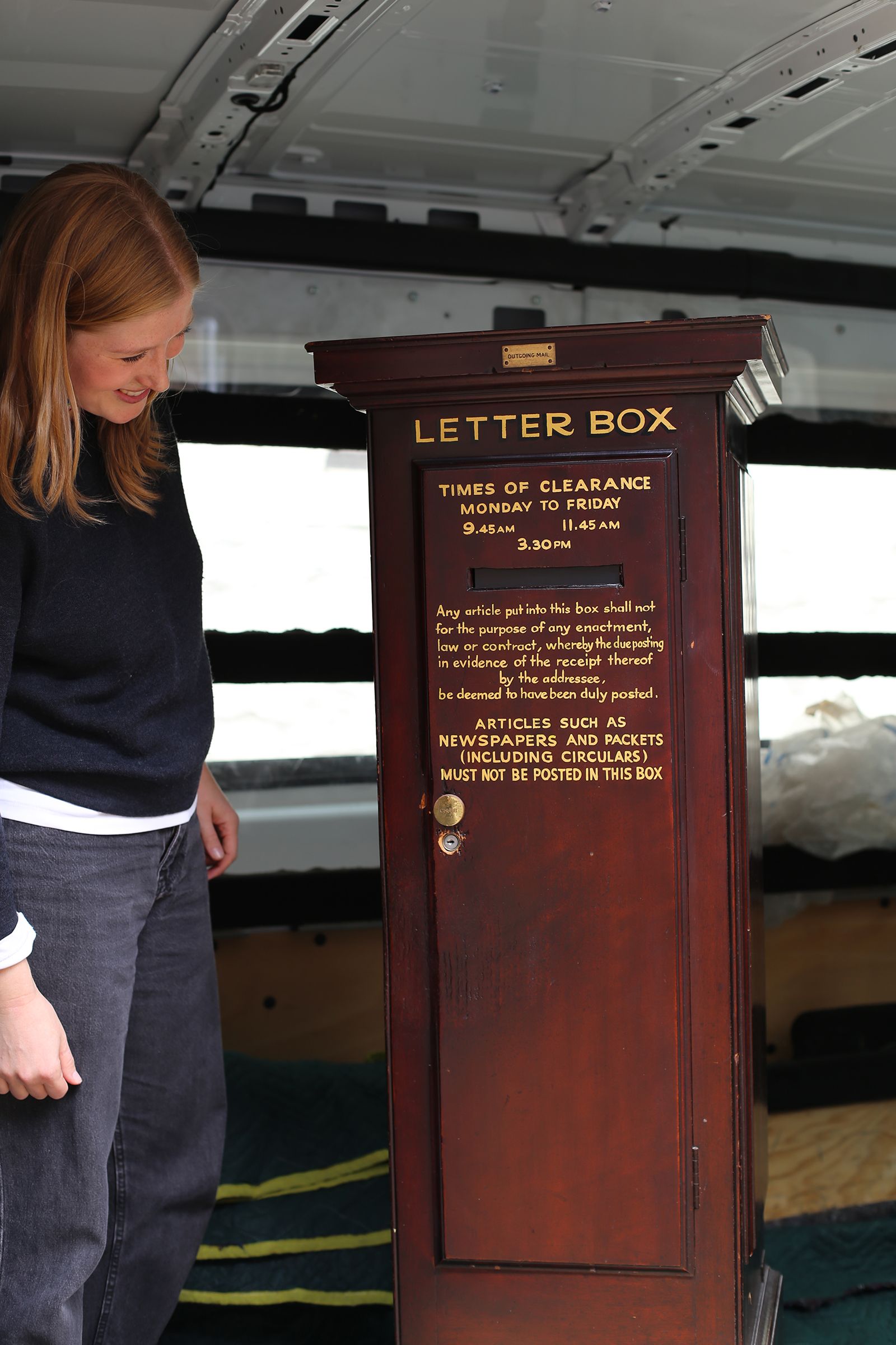Collections and Loans Officer Meg Driver loads the letter box for transportation