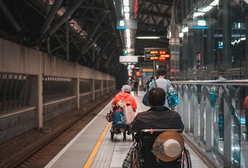two transit riders in wheelchairs 