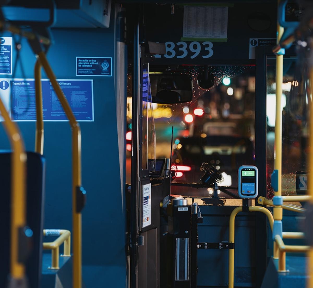 A forward facing view of the interior of a bus