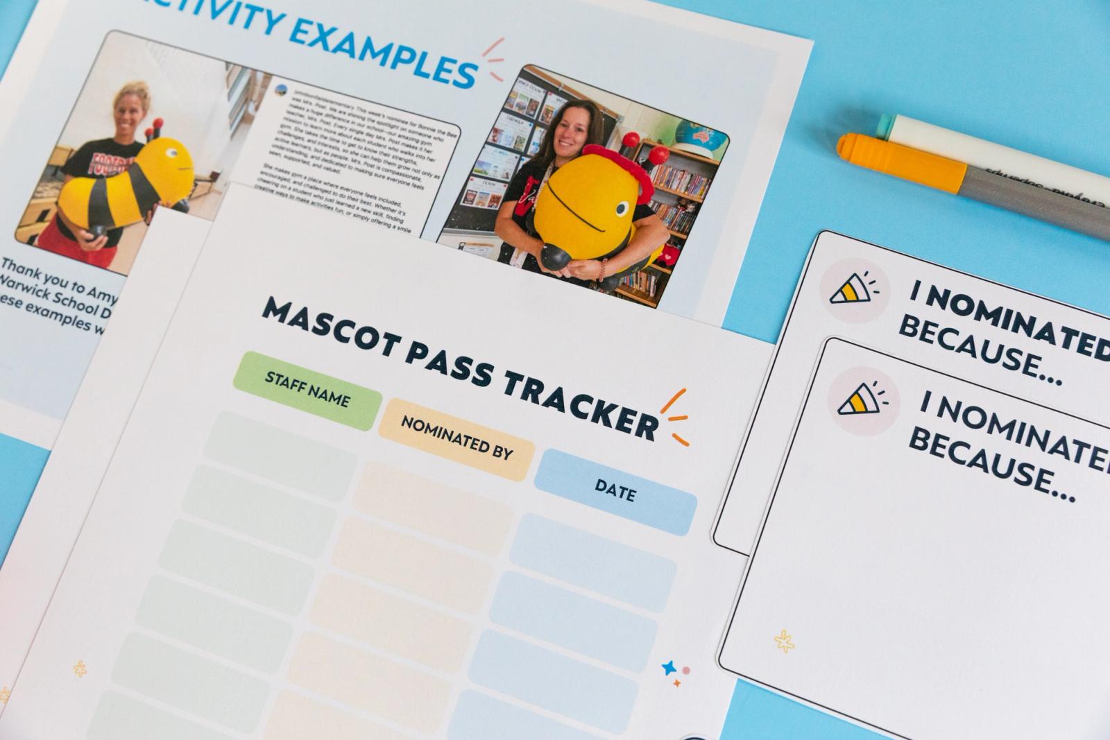 Closeup of a sheet of paper that says "mascot pass tracker" on a light blue background. 