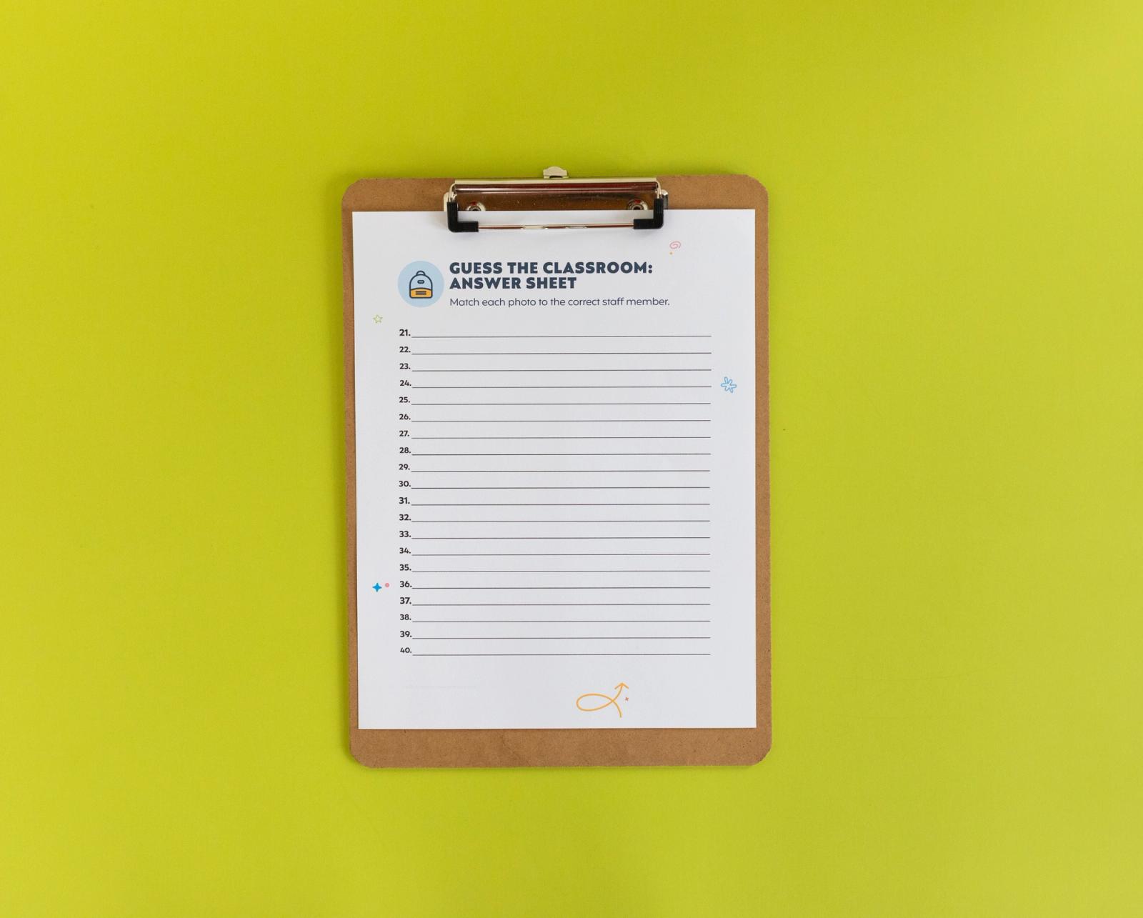 Clipboard with a sheet of paper on it lays on a light green background.