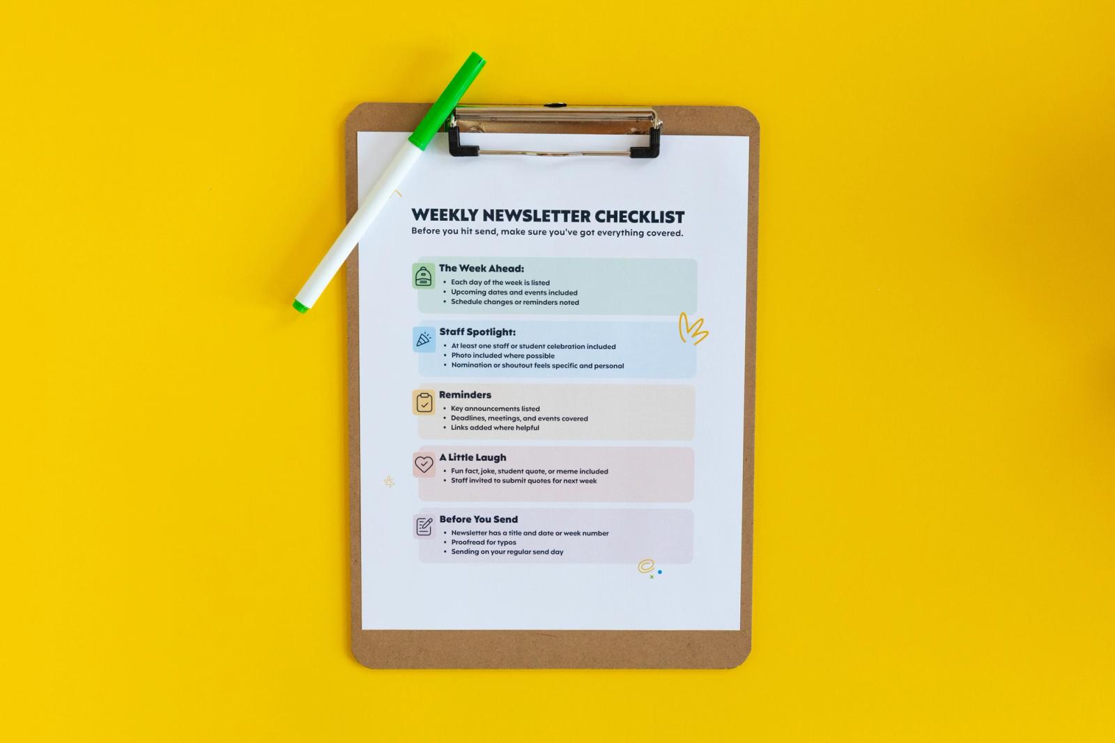 White paper with colored rectangles printed on it on a clipboard with a green marker on yellow background
