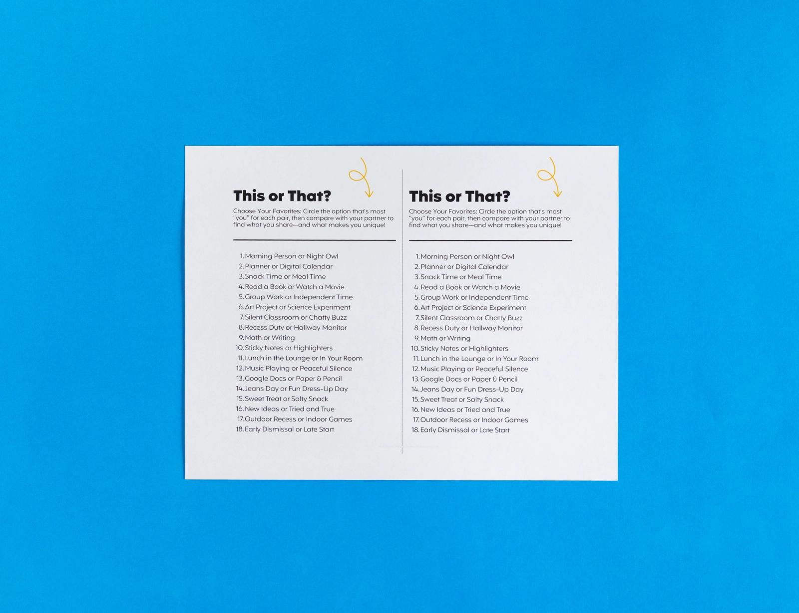 A sheet of paper that says "This or That" lays on a blue background.