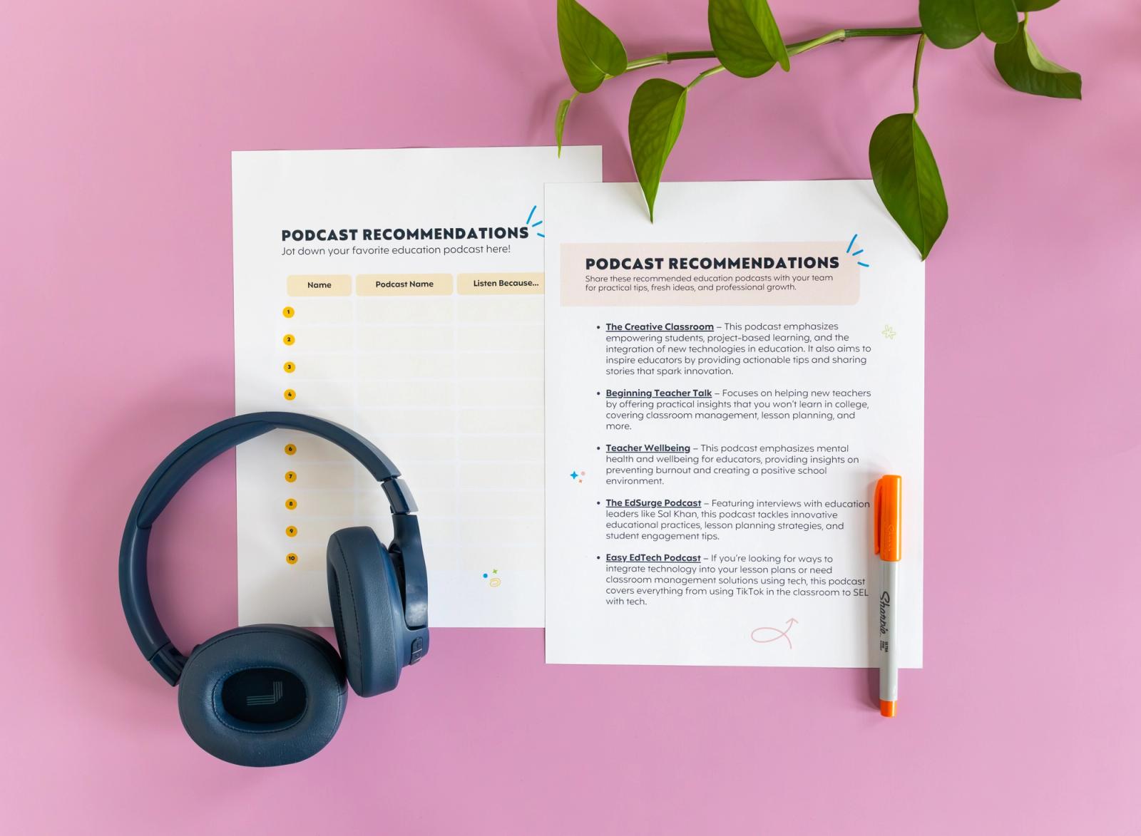 Two sheets of paper, a set of black over-the-ear headphones, and an orange pen lay on a pink background.