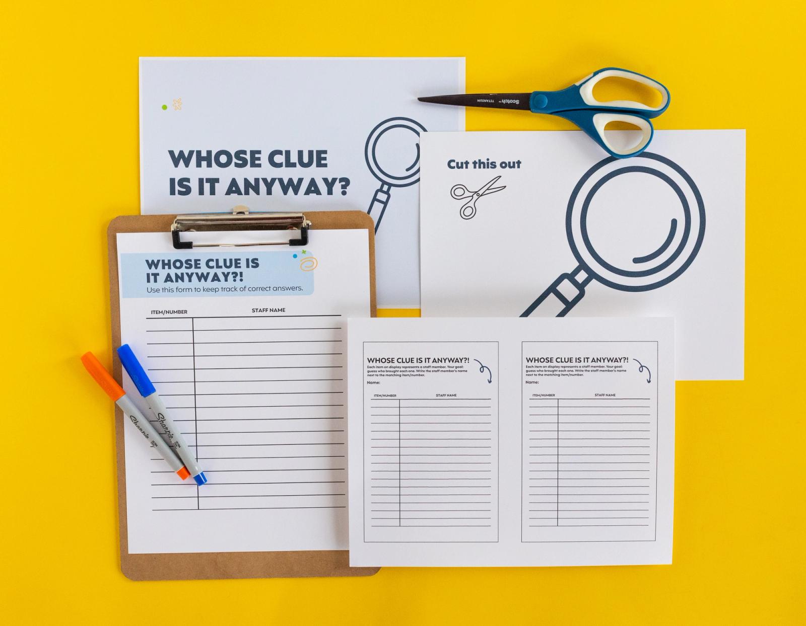 Sheets of paper, clipboard, markers, and scissors lay on a yellow background.