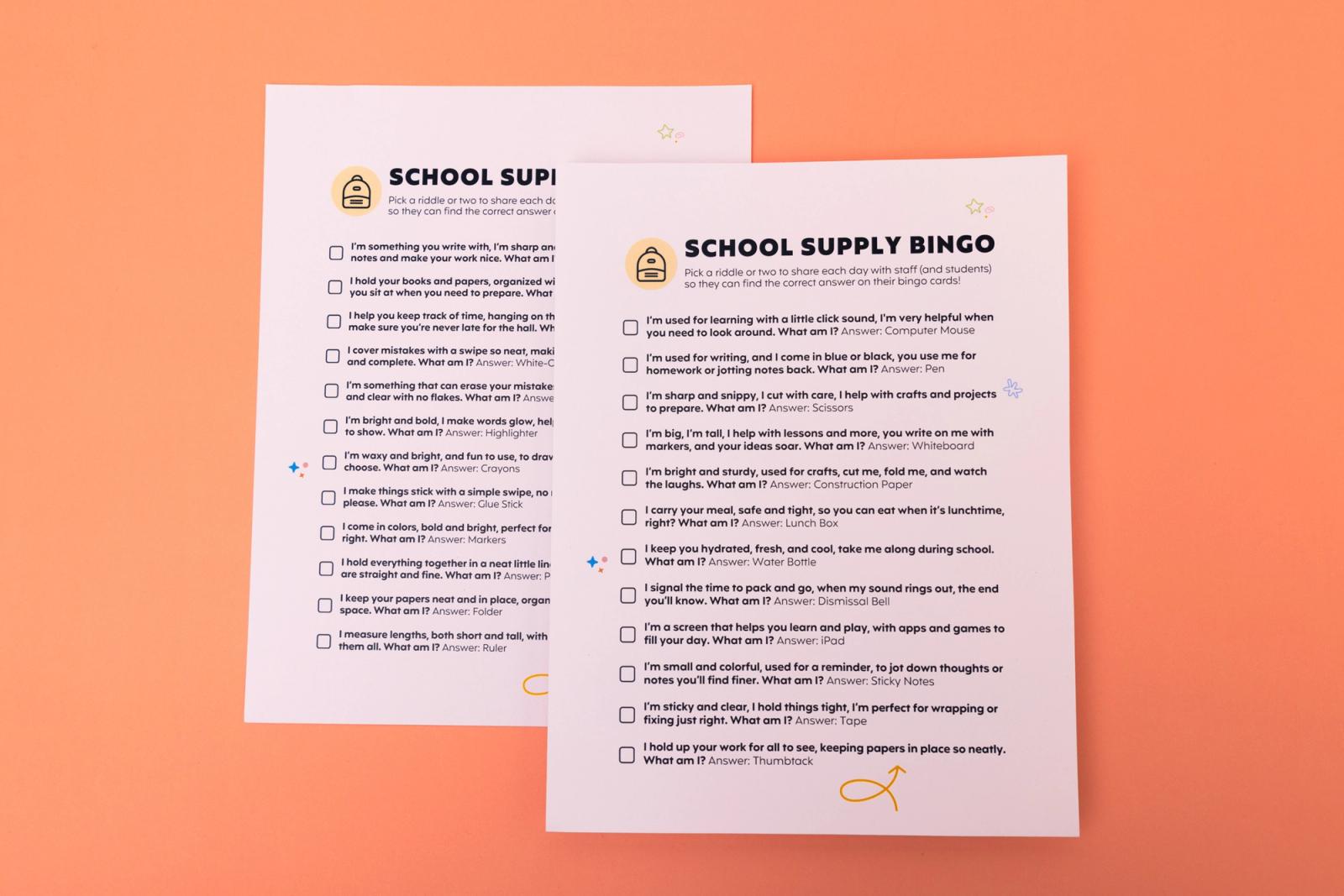 Two sheets of paper that say "school supply bingo" lay on a pink background.