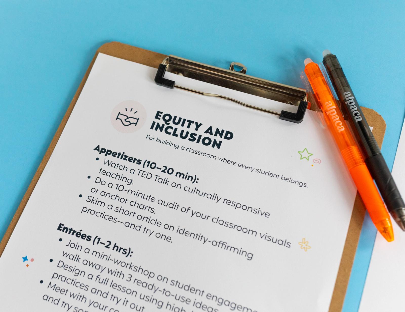 Closeup of a clipboard with a piece of paper that says "equity and inclusion" on it sits on a light blue background. An orange and black pen lay on the clipboard.