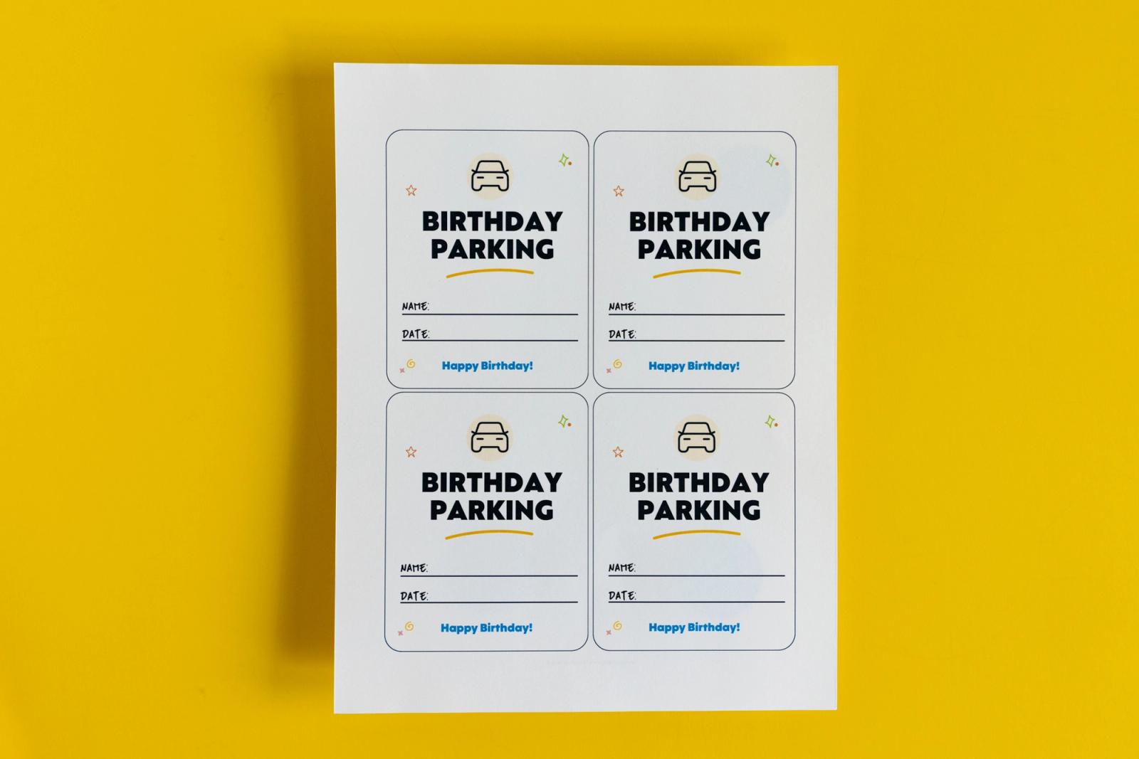 A piece of paper that says "birthday parking" lay on a yellow background.