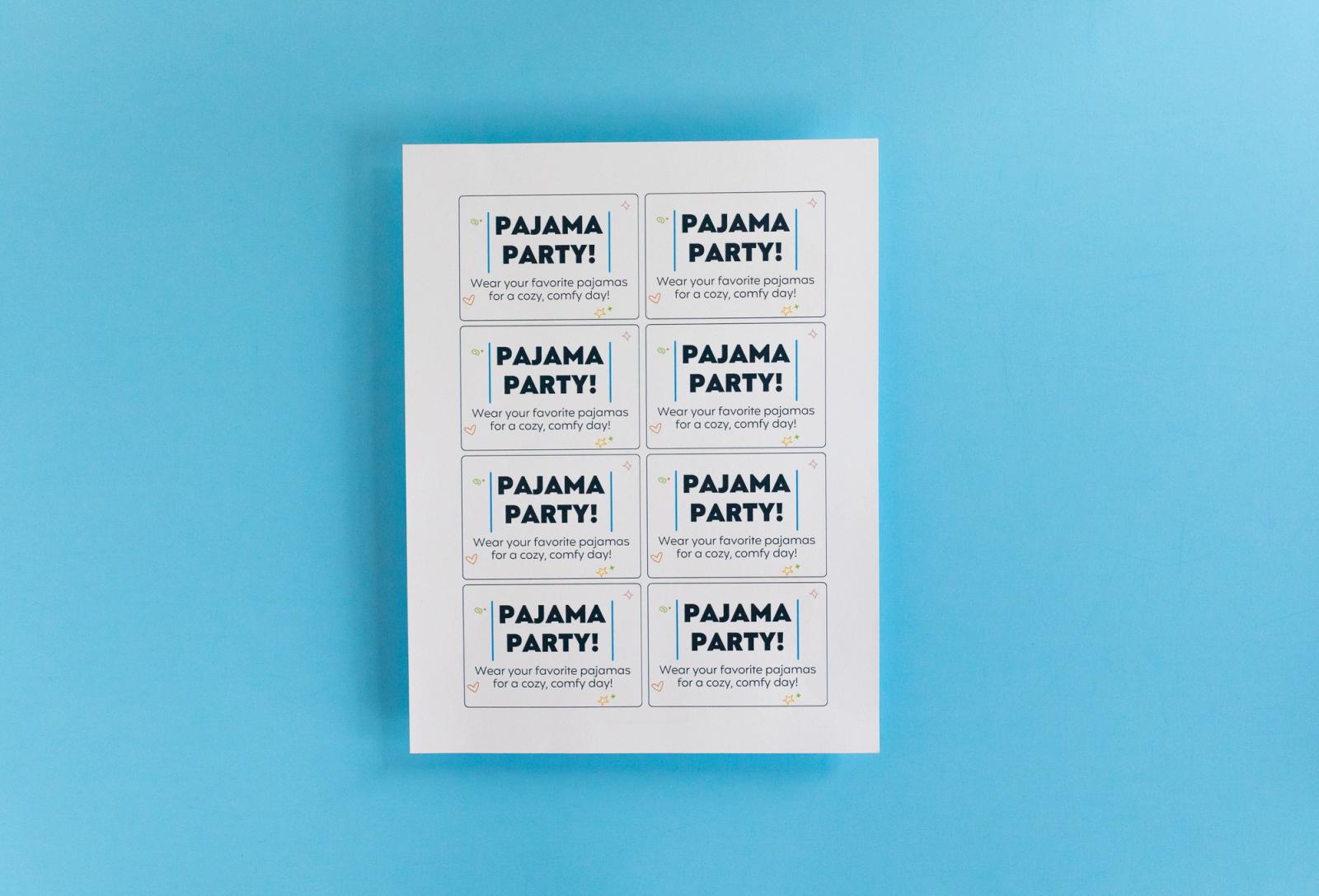 Sheet with coupons that say "pajama party" lays on a light blue background.
