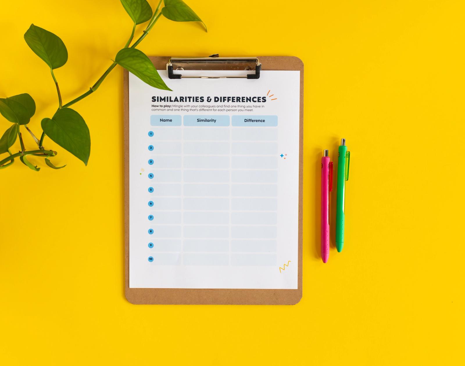 A clipboard with a sheet of paper sits on a yellow background. Plant vines lay on the left side of the clipboard, and two pens lay on the right side.