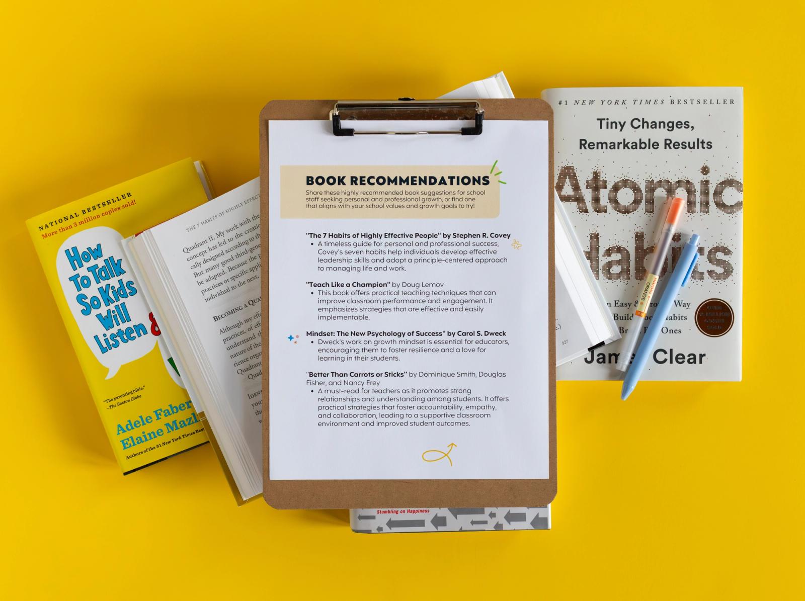Sheet of paper that says "book recommendations" is on a clipboard. Three books lay on a yellow background around the clipboard.