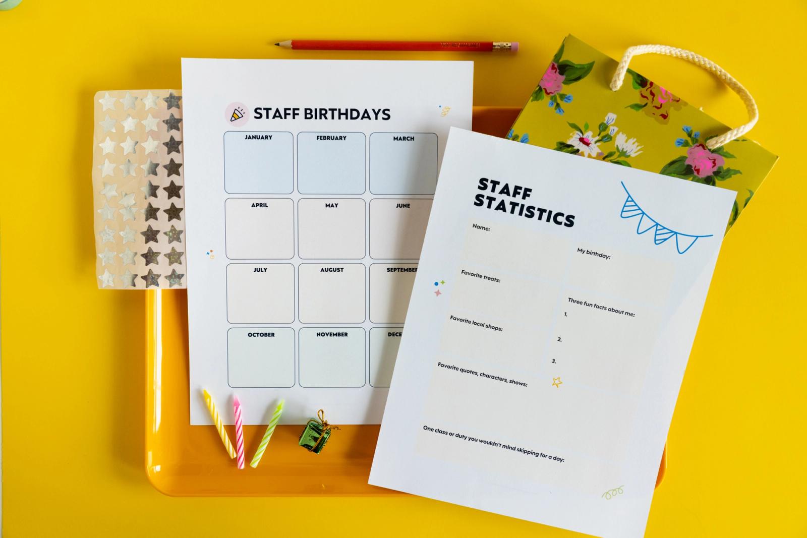Two pieces of paper, a gift bag, and candles lay on a yellow background.