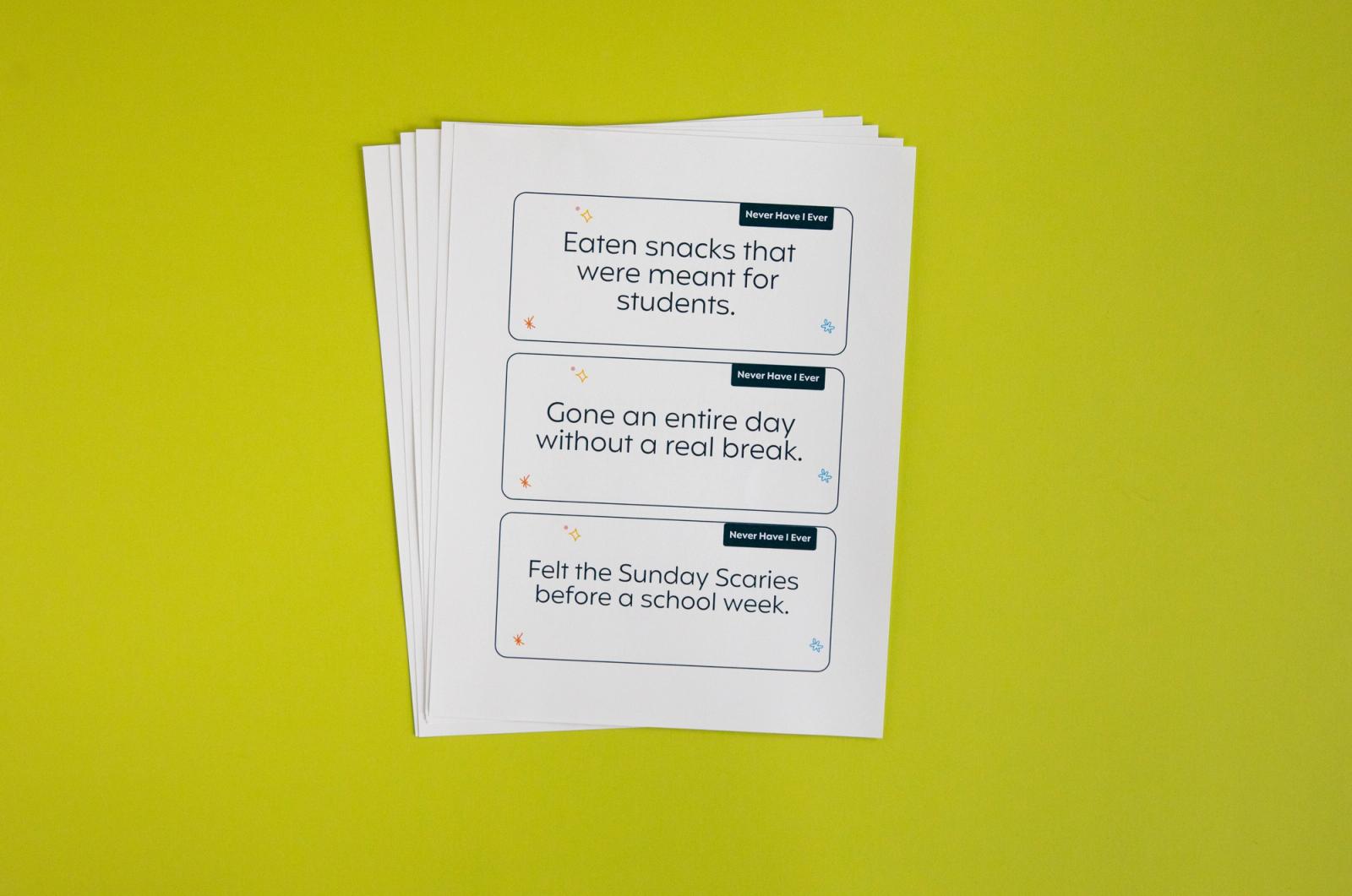 Sheets of paper lay fanned out on a light green background.