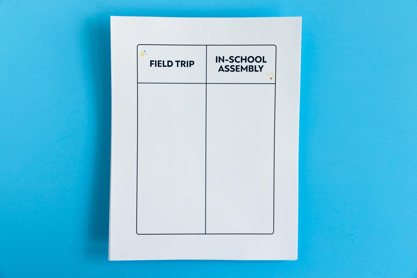 Sheet of paper that says "field trip" and "in-school assembly" on it lays on a light blue background.