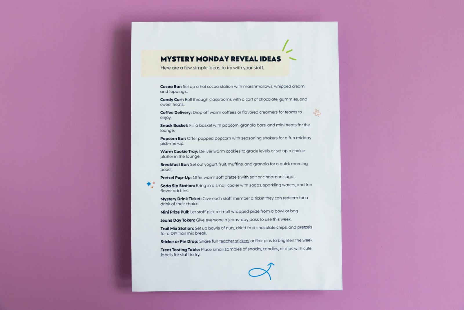 A sheet of paper that says "mystery Monday reveal ideas" lays on a light purple background.