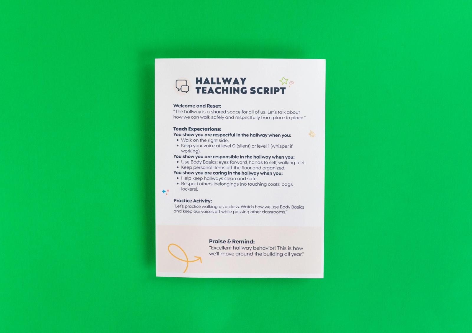 A sheet of paper that says "hallway teaching script" on it lays on a green background.