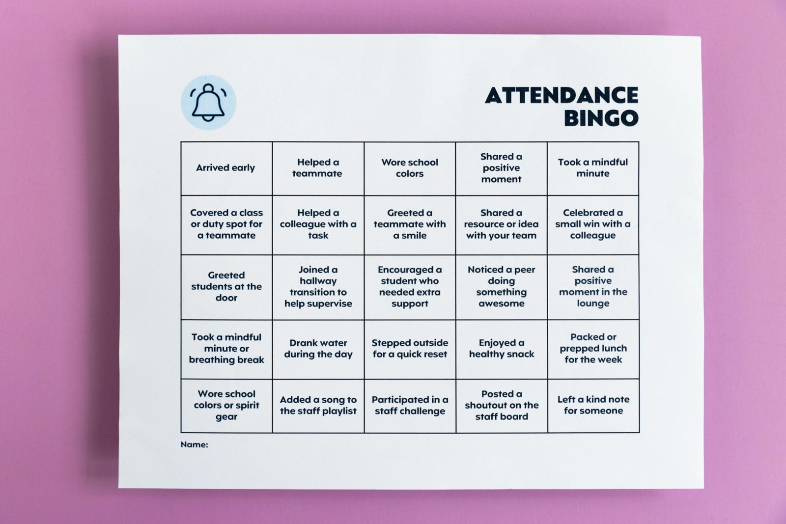 A sheet of paper that says "attendance bingo" lays on a light purple background.