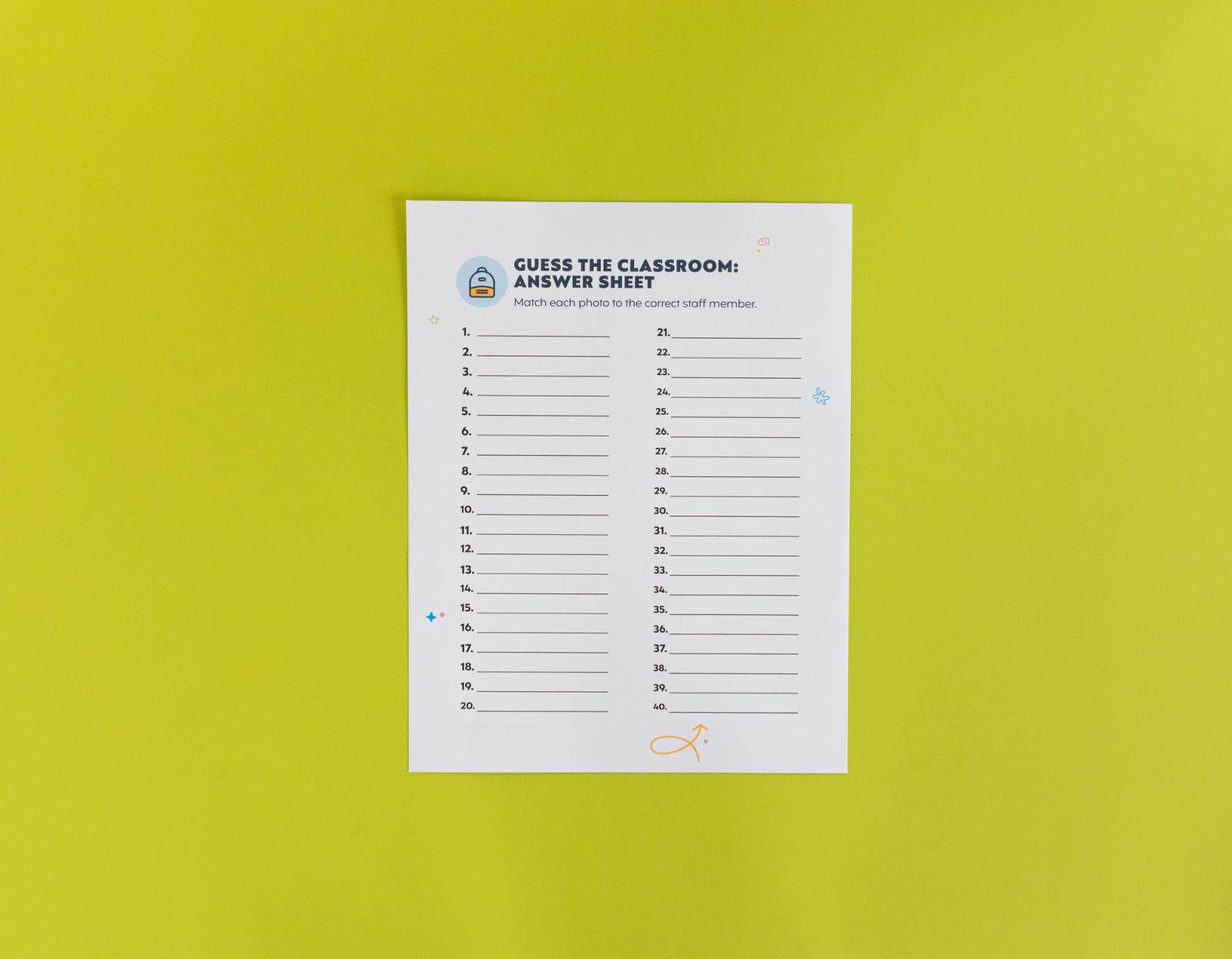 Sheet of paper that says "guess the classroom answer sheet" lays on a light green background.