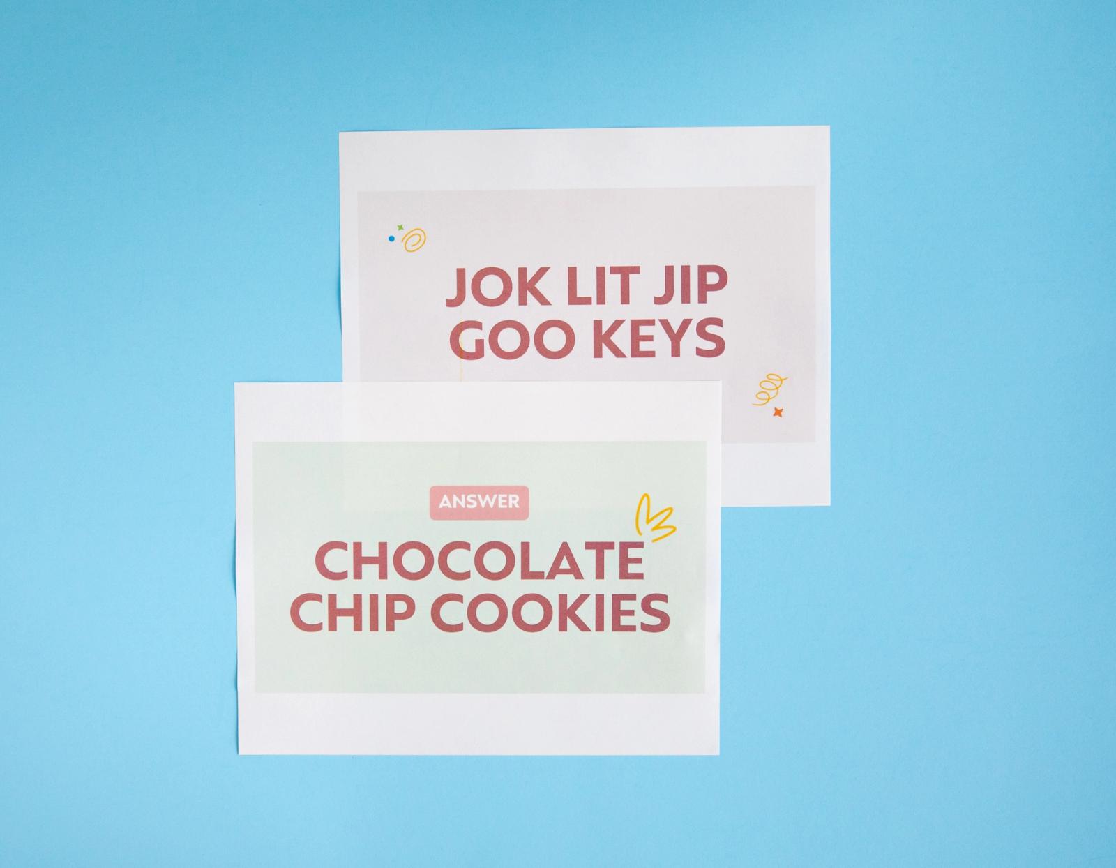 Two sheets of paper with word jumbles lay on a light blue background.