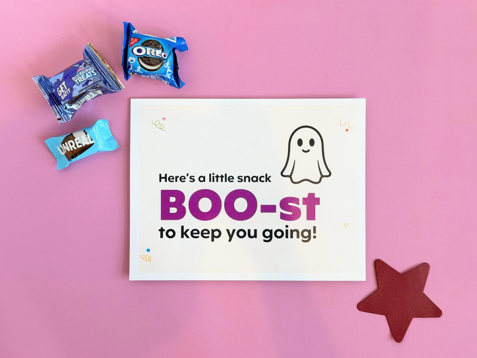 Ghost-themed snack sign for a Halloween teacher morale booster, styled with packaged snacks and a red paper star