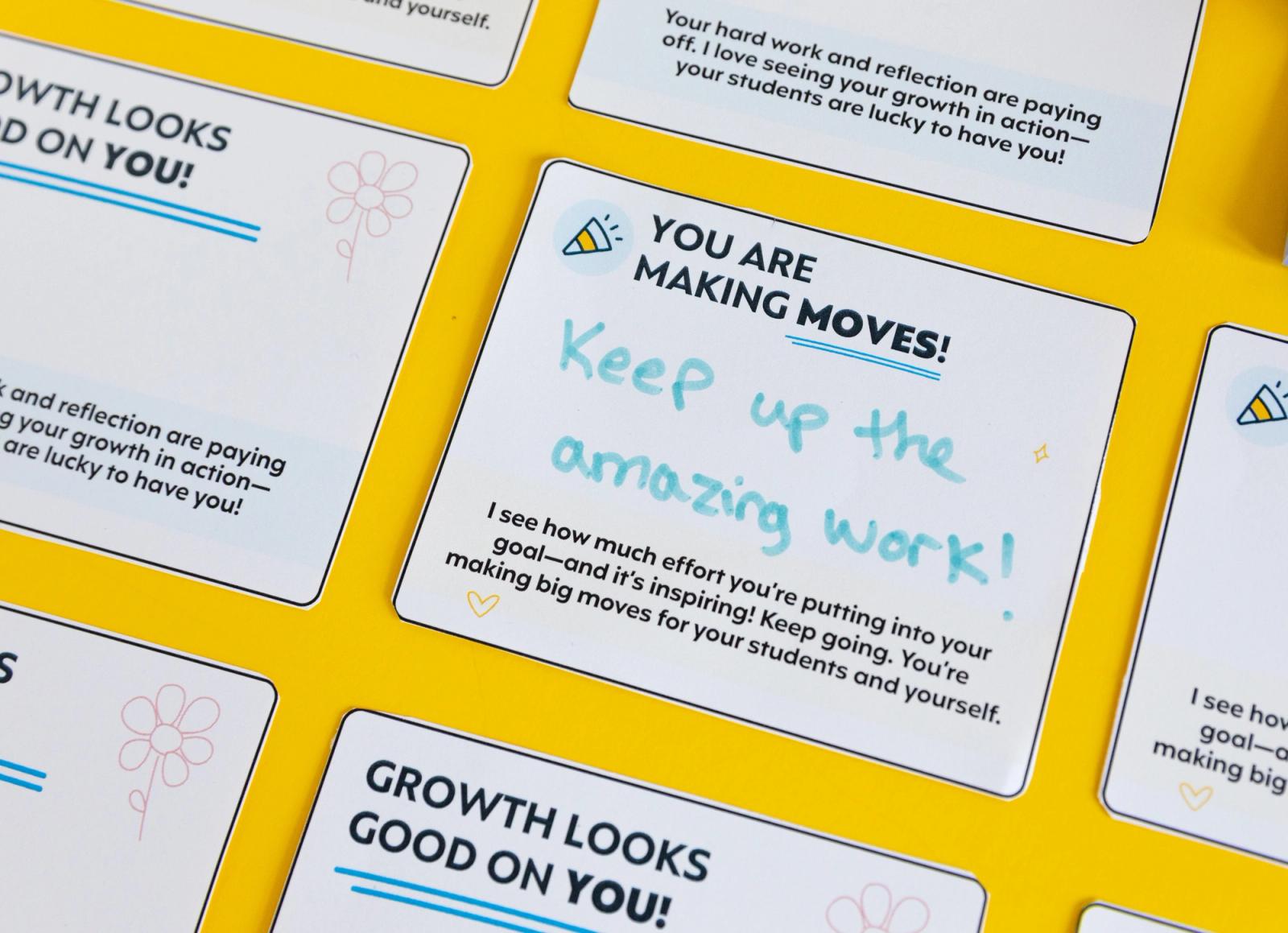 Closeup of a handwritten note of encouragement on a yellow background.
