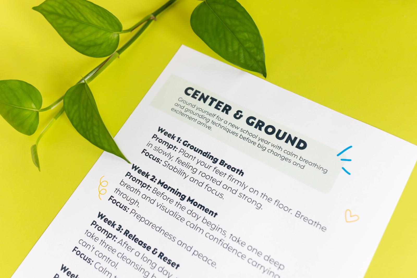 A side view of a piece of paper with a plant vine next to it on a bright green background.