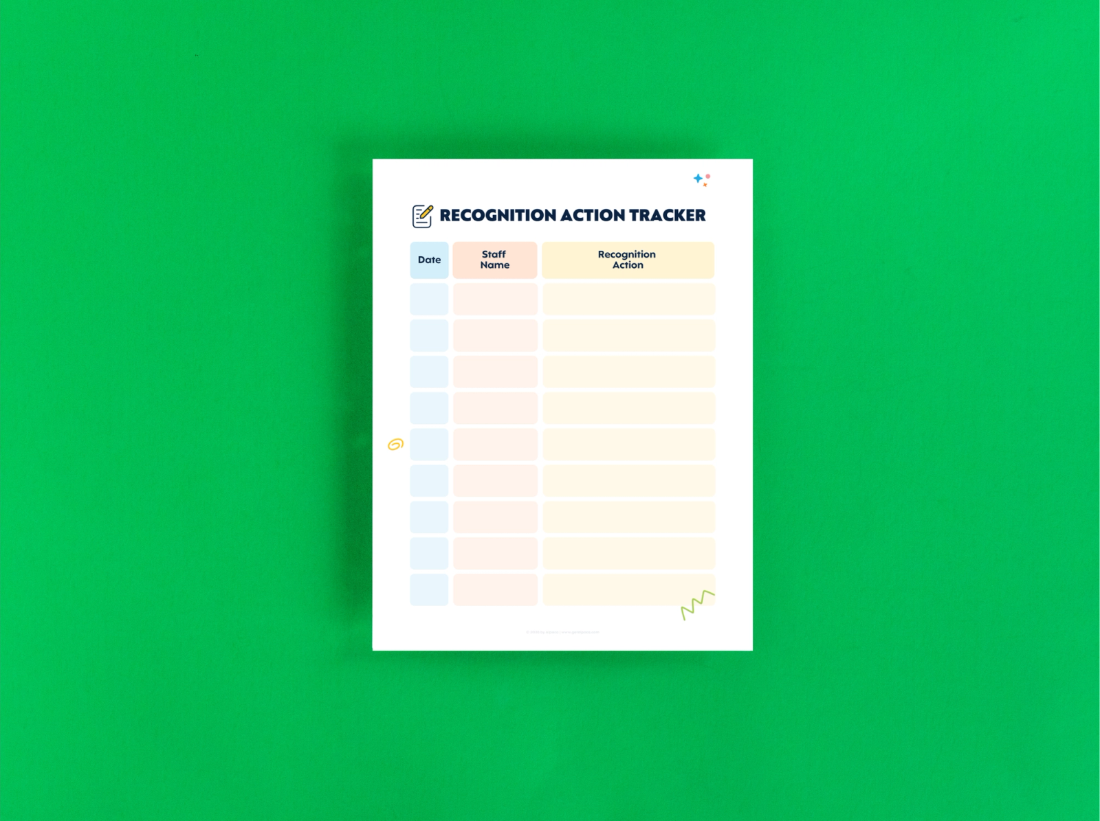 A sheet of paper that says "recognition action tracker" lays on a green background