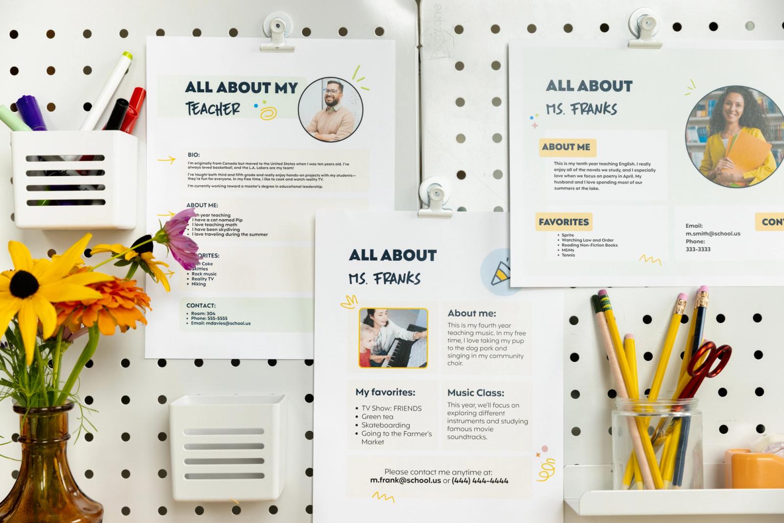 A whiteboard with three posters introducing new teachers. A jar of pencils and flower vase sits in front of them.