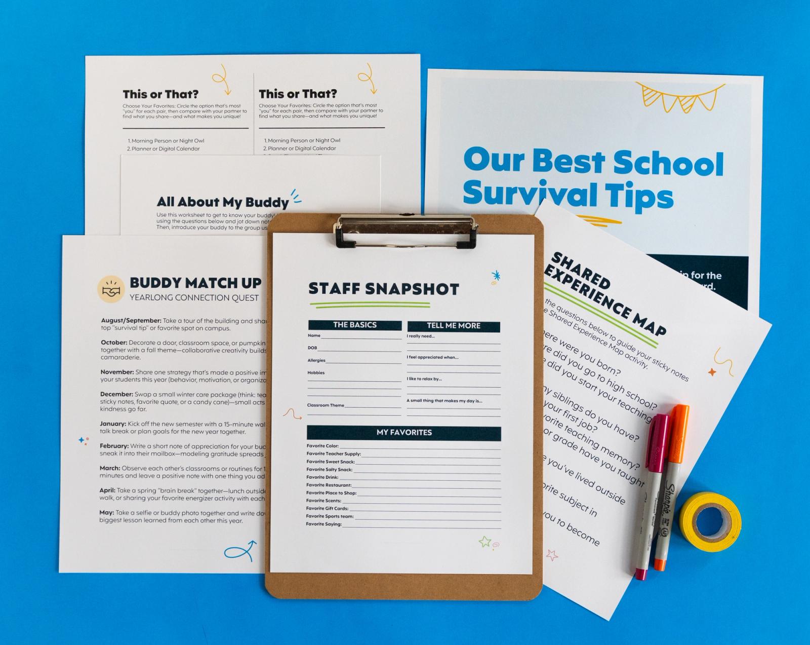 Several sheets of paper, clipboard with a paper on it, pens and tape lay on a blue background.