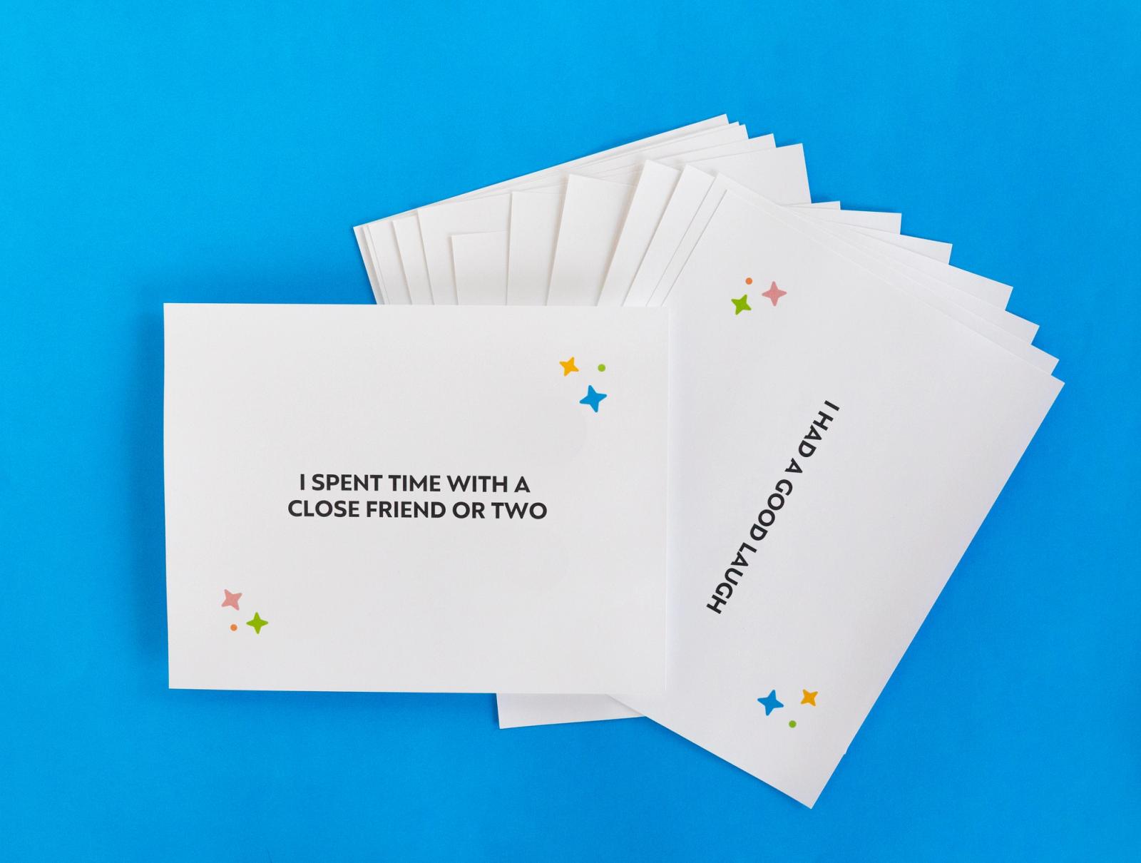 Several sheets of paper fanned out lay on a blue background.