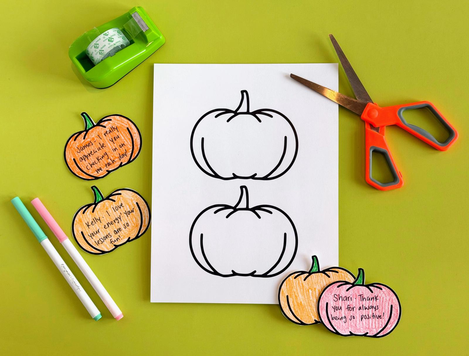Large pumpkin template surrounded by cut-out paper pumpkins with positive notes to staff, plus markers, scissors, and tape for a fall staff appreciation display.