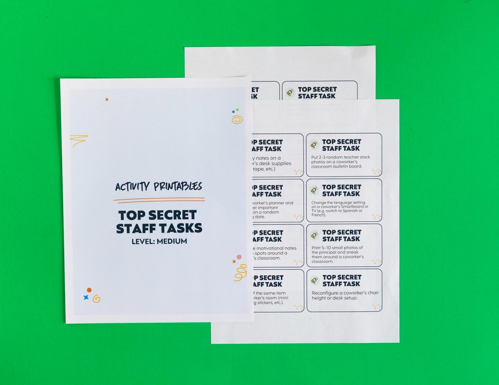 Two sheets of paper lay on a green background. One says "top secrete staff tasks: level: medium." 