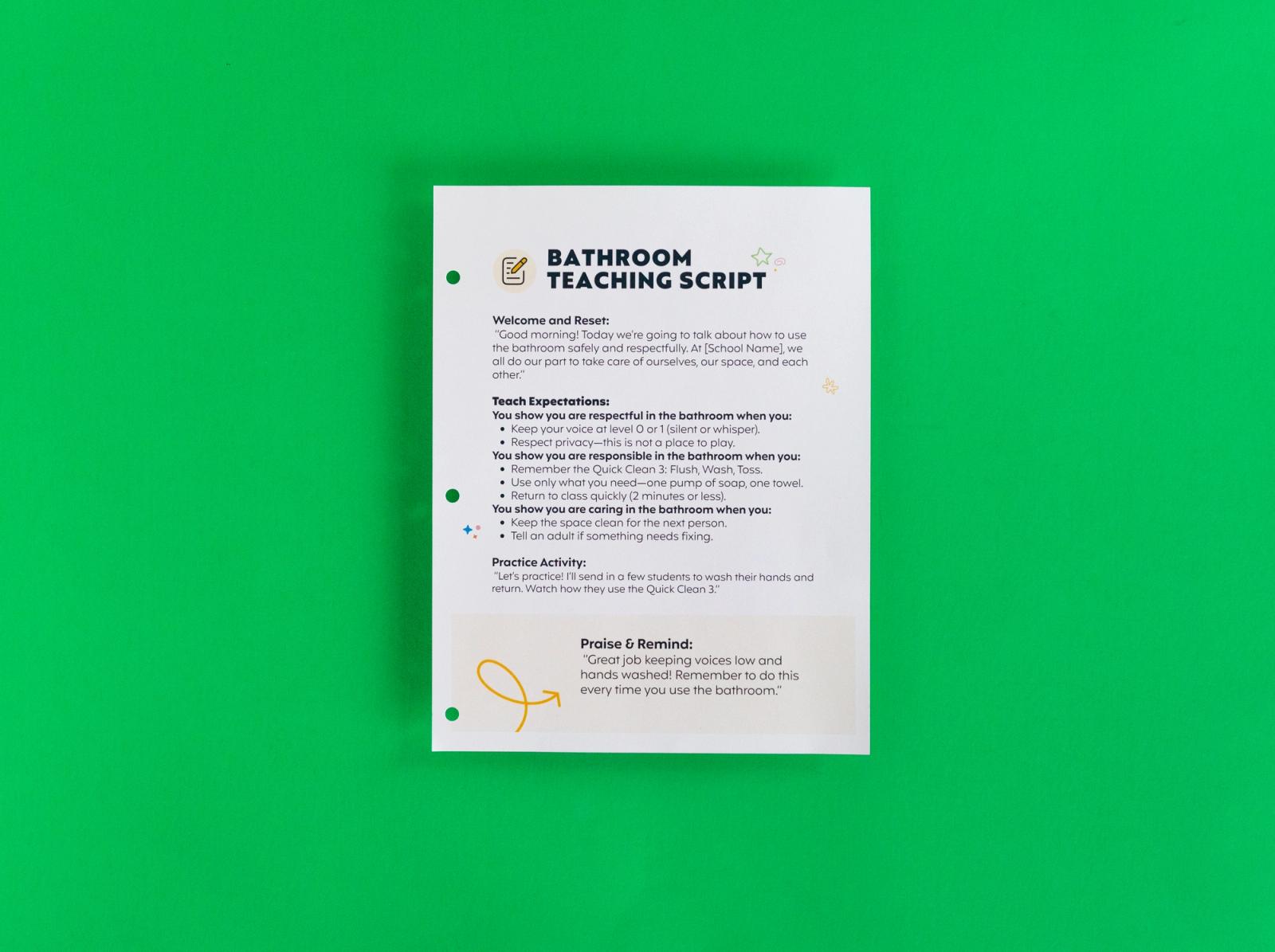 A sheet of paper that says "bathroom teaching script" on it lays on a green background.