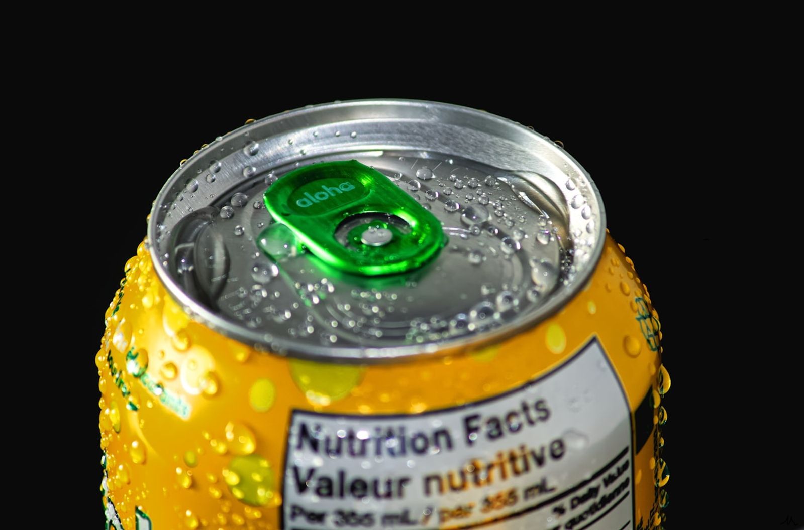 A close up of a nutrition information panel on the back of a food package, showing rows of figures for serving size, sugars and sodium, photo by James Yarema on Unsplash