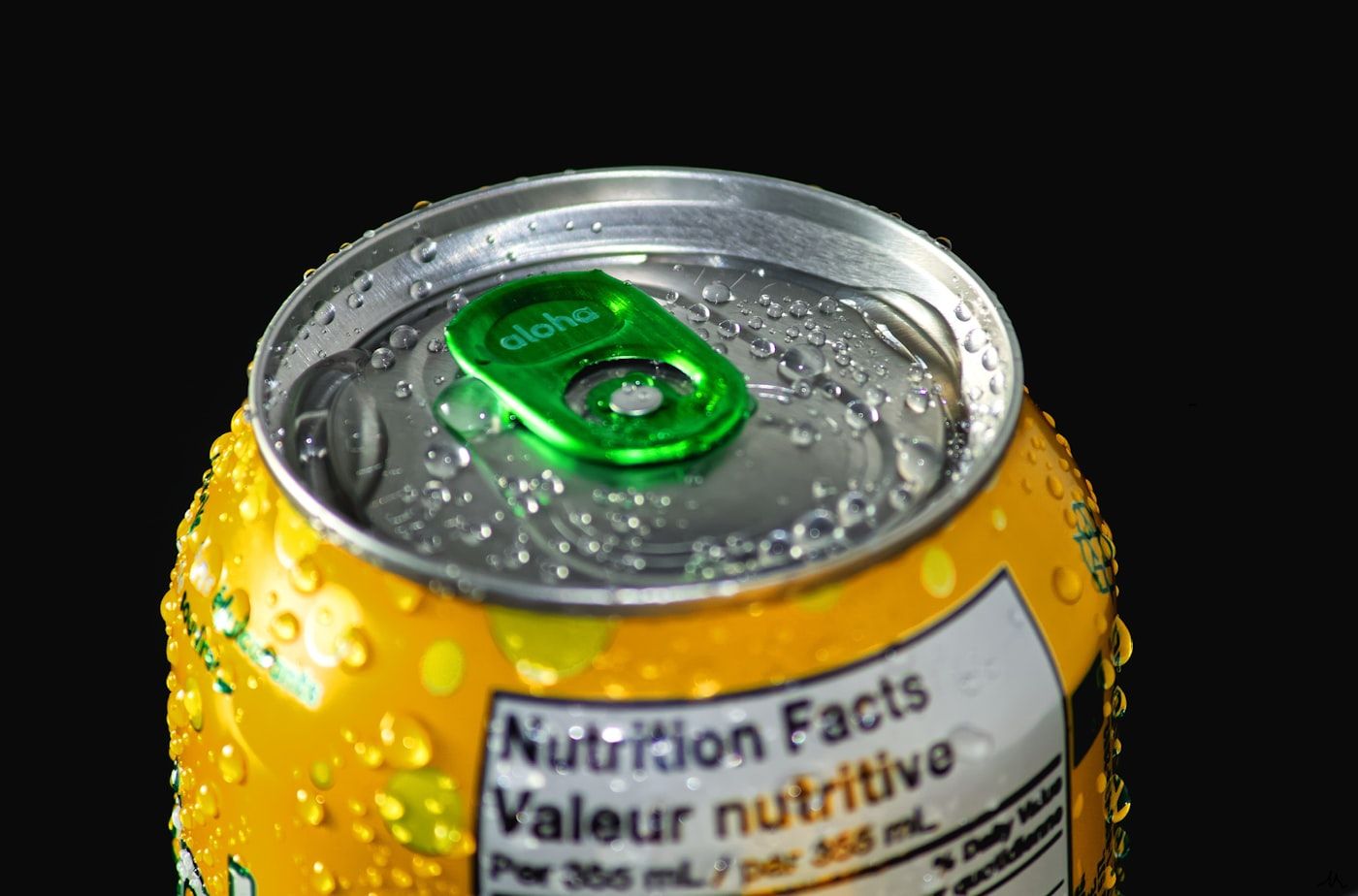 A close up of a nutrition information panel on the back of a food package, showing rows of figures for serving size, sugars and sodium, photo by James Yarema on Unsplash
